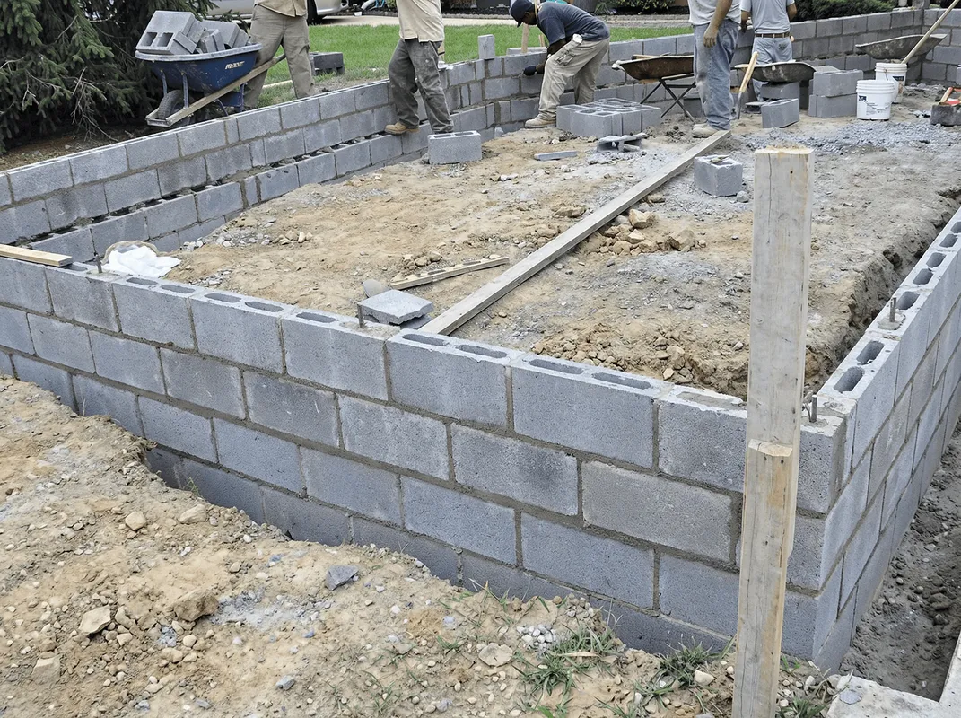 Professionals building a foundation with blocks in Minneapolis, MN