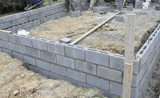 Professionals building a foundation with blocks in Minneapolis, MN
